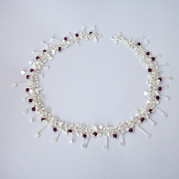 Blossom & Bloom Necklace with garnet, satin silver by Fiona DeMarco