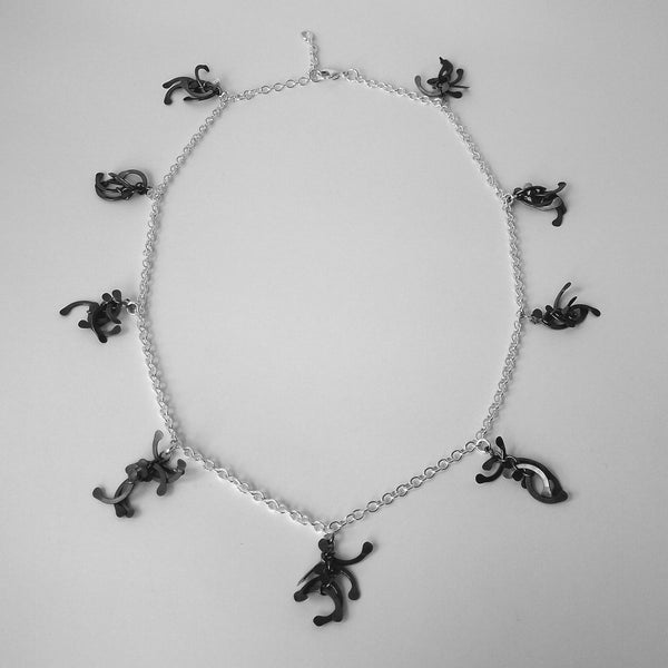 Contour charm Necklace, oxidised silver by Fiona DeMarco