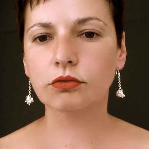 Radiance dangling Earrings, polished silver by Fiona DeMarco
