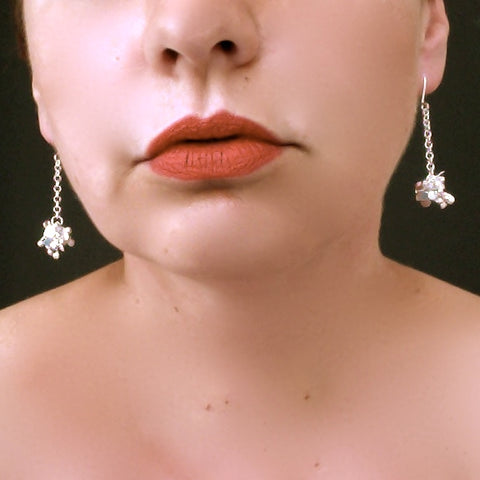 Radiance dangling Earrings, polished silver by Fiona DeMarco