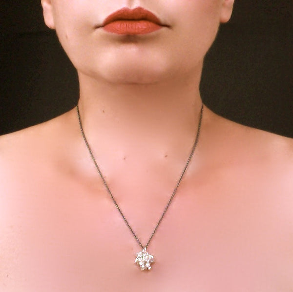 Radiance Pendant, polished silver on oxidised silver chain by Fiona DeMarco