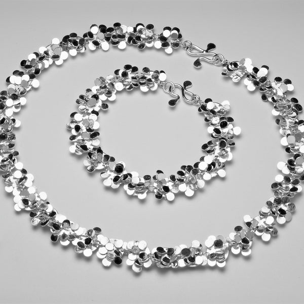 Symphony Necklace and Bracelet, polished silver by Fiona DeMarco