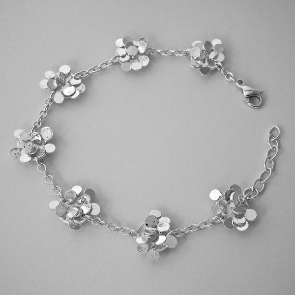 Symphony charm Bracelet, polished silver by Fiona DeMarco