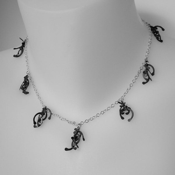 Contour charm Necklace, oxidised silver by Fiona DeMarco