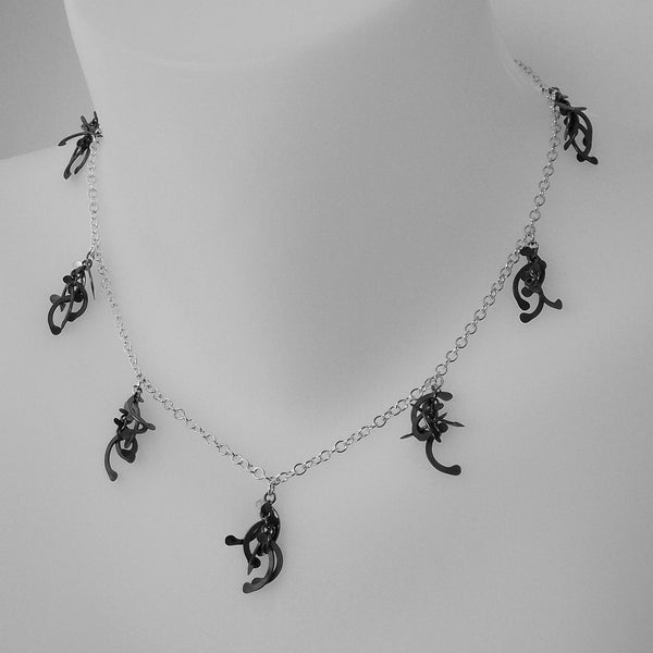 Contour charm Necklace, oxidised silver by Fiona DeMarco