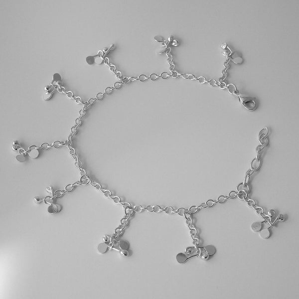 Accent charm Bracelet, polished silver by Fiona DeMarco