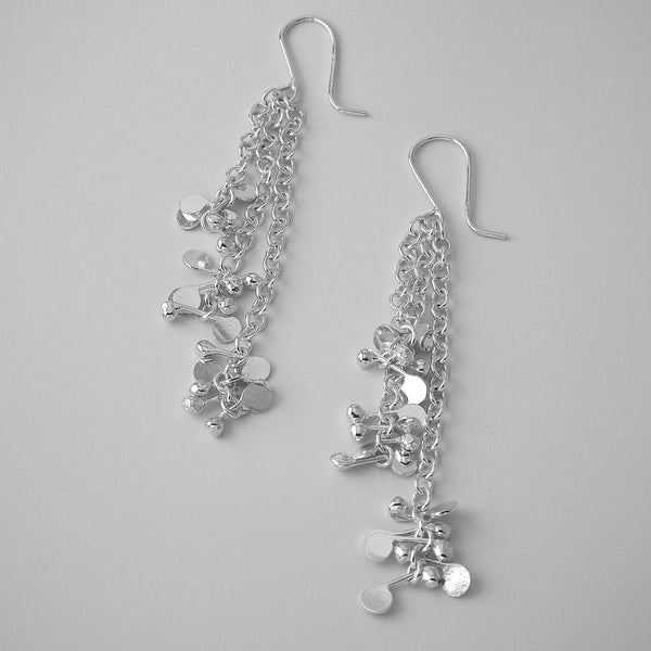 Accent dangling Earrings, polished silver by Fiona DeMarco