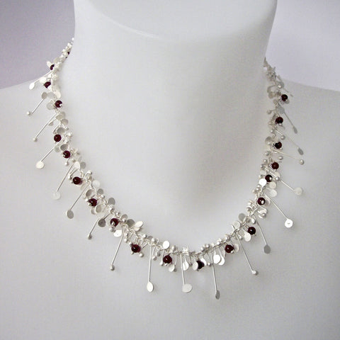 Blossom & Bloom Necklace with garnet, satin silver by Fiona DeMarco