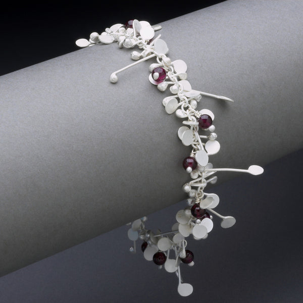 Blossom & Bloom Bracelet with garnet, satin silver by Fiona DeMarco