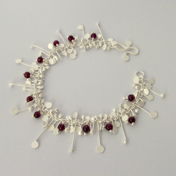 Blossom & Bloom Bracelet with garnet, satin silver by Fiona DeMarco