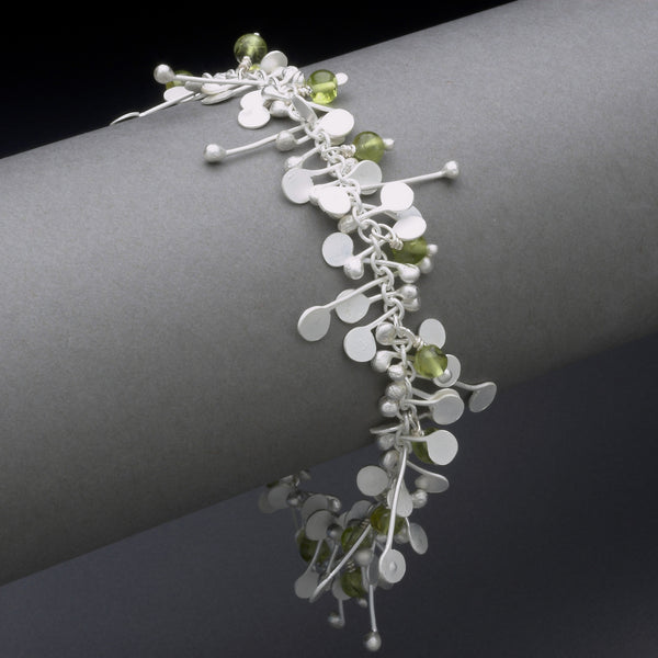 Blossom & Bloom Bracelet with peridot, satin silver by Fiona DeMarco