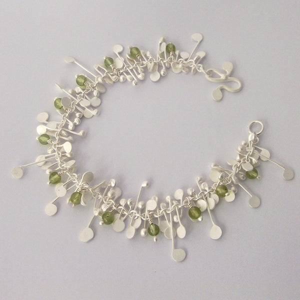 Blossom & Bloom Bracelet with peridot, satin silver by Fiona DeMarco