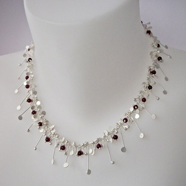 Blossom & Bloom Necklace with garnet, satin silver by Fiona DeMarco