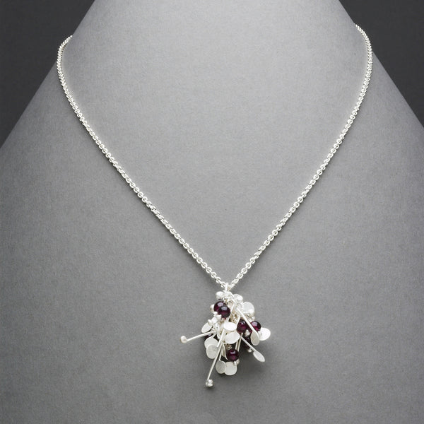 Blossom & Bloom Pendant with garnet, satin silver by Fiona DeMarco