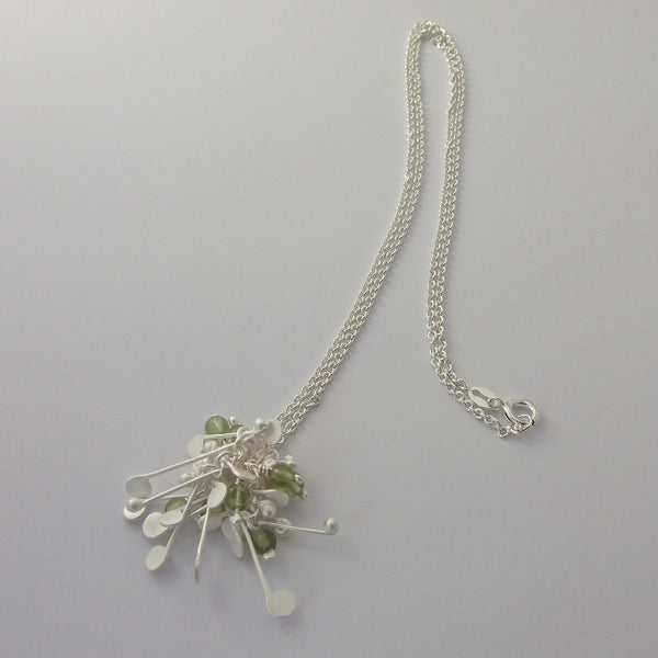 Blossom & Bloom Pendant with peridot, satin silver by Fiona DeMarco
