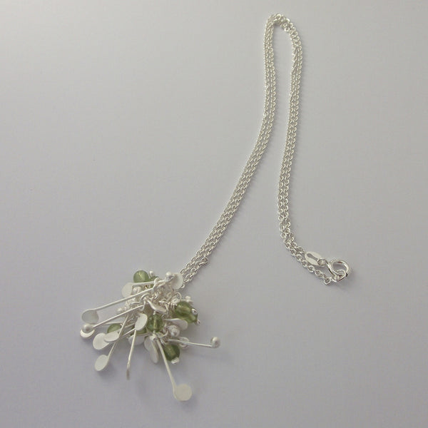Blossom & Bloom Pendant with peridot, satin silver by Fiona DeMarco