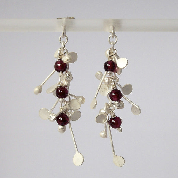 Blossom & Bloom stud Earrings with garnet, satin silver by Fiona DeMarco