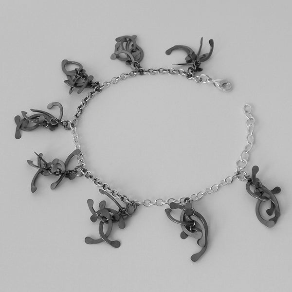 Contour charm Bracelet, oxidised silver by Fiona DeMarco