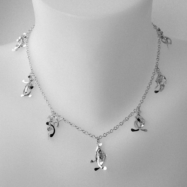 Contour charm Necklace, polished silver by Fiona DeMarco