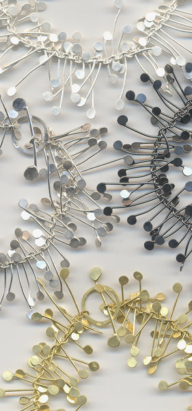 Signature bracelets, silver and gold by Fiona DeMarco