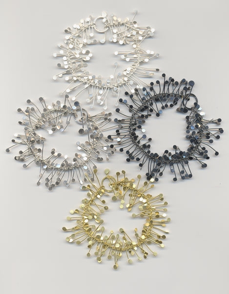 Signature bracelets, silver and gold by Fiona DeMarco