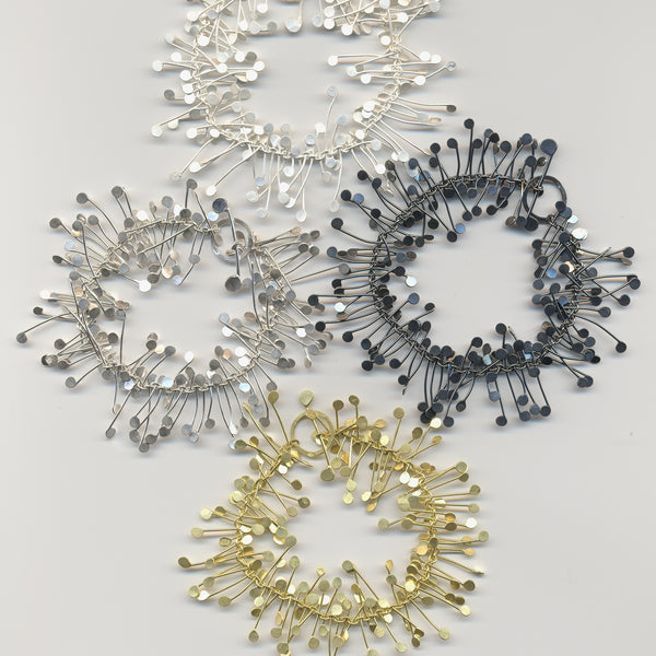 Signature bracelets, silver and gold by Fiona DeMarco