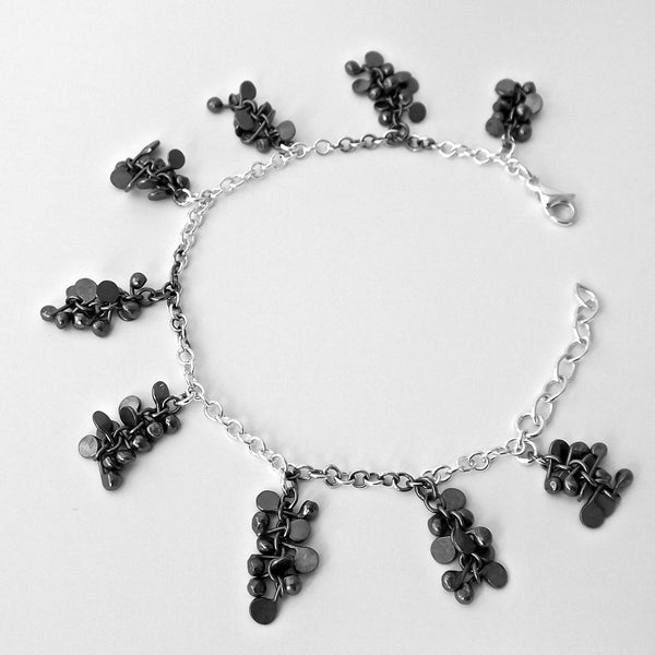 Harmony charm Bracelet, oxidised silver by Fiona DeMarco