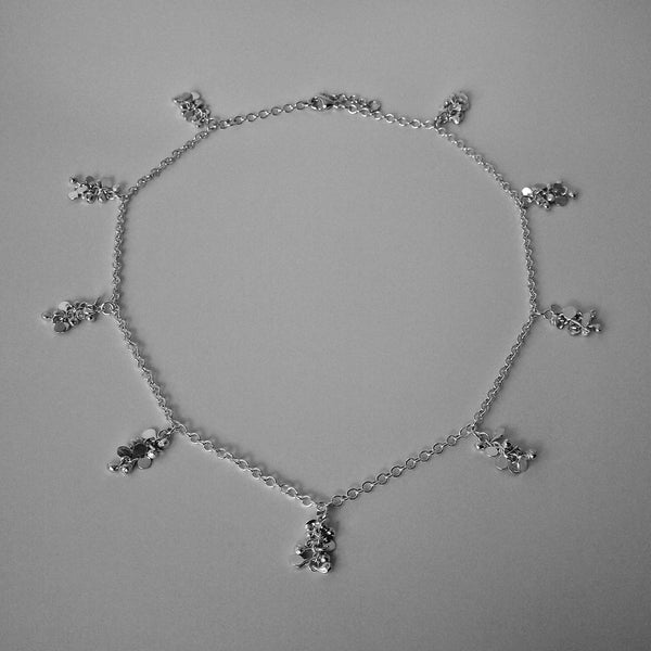 Harmony charm Necklace, polished silver by Fiona DeMarco