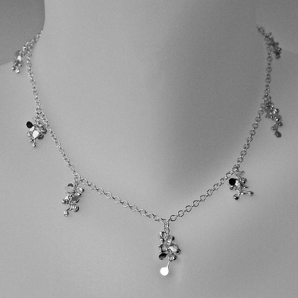 Harmony charm Necklace, polished silver by Fiona DeMarco