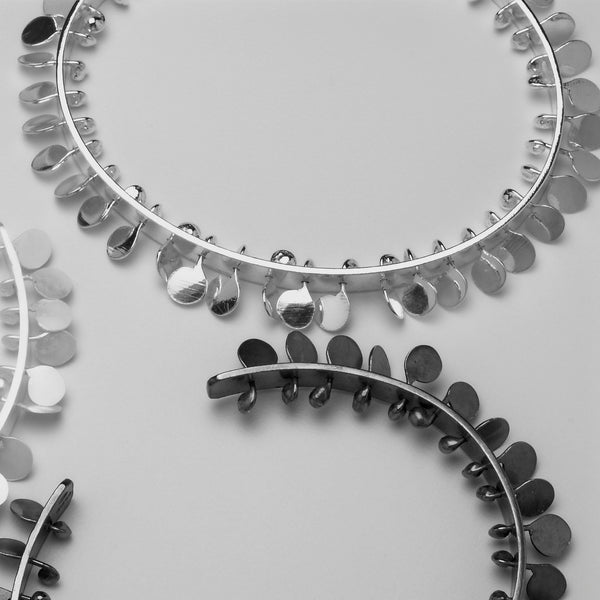 Icon Bangles, polished, oxidised and satin silver by Fiona DeMarco