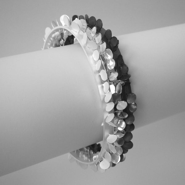 Icon Bangles, satin, polished and oxidised silver by Fiona DeMarco