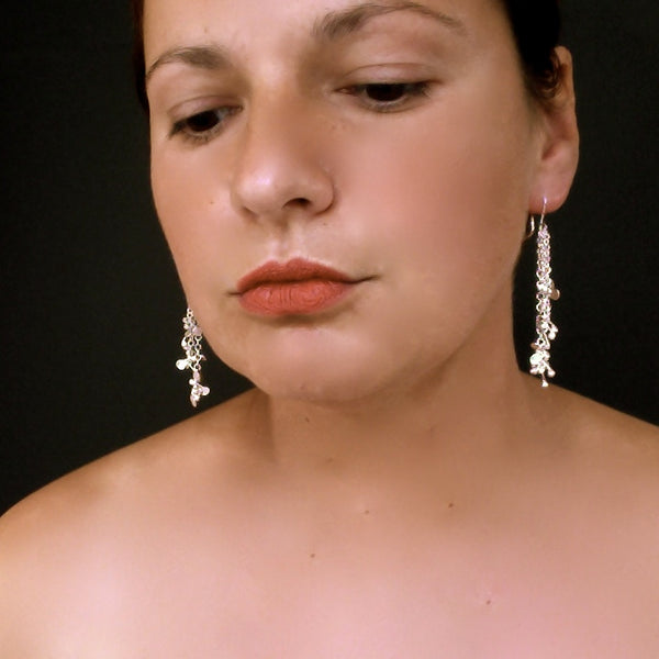 Accent dangling Earrings, polished silver by Fiona DeMarco