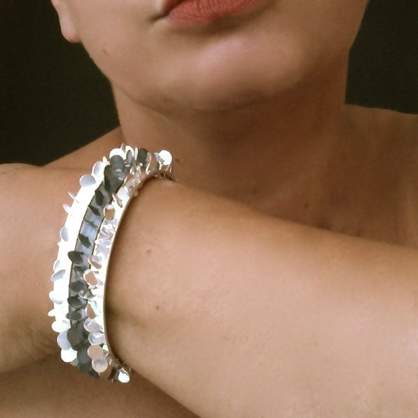Icon Bangles, polished, oxidised and satin silver by Fiona DeMarco