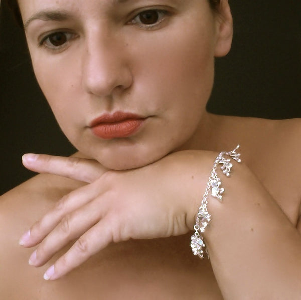Harmony charm Bracelet, polished silver by Fiona DeMarco