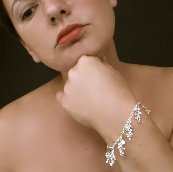 Harmony charm Bracelet, polished silver by Fiona DeMarco