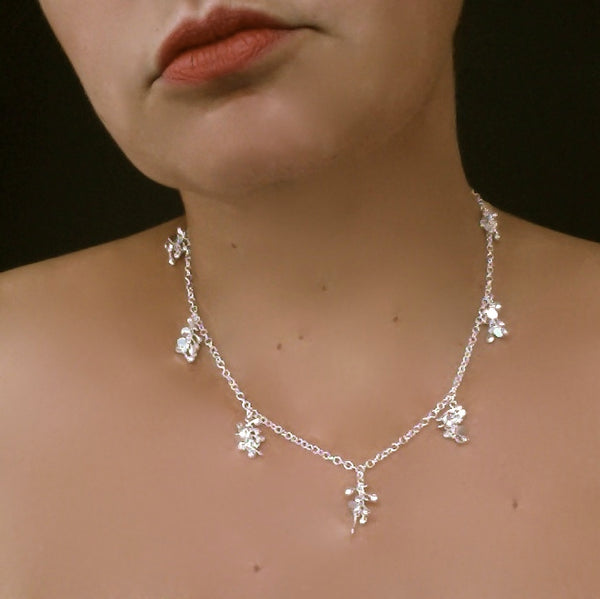 Harmony charm Necklace, polished silver by Fiona DeMarco