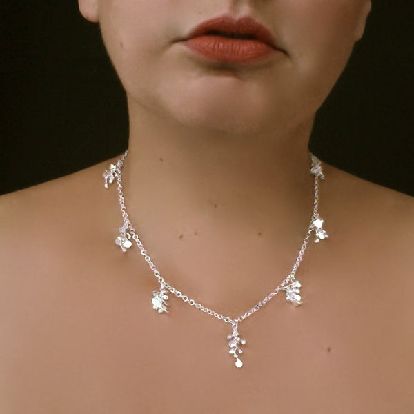 Harmony charm Necklace, polished silver by Fiona DeMarco