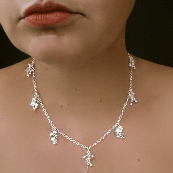 Harmony charm Necklace, polished silver by Fiona DeMarco