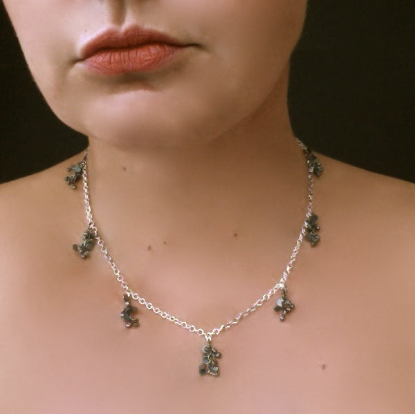 Harmony charm Necklace, oxidised silver by Fiona DeMarco