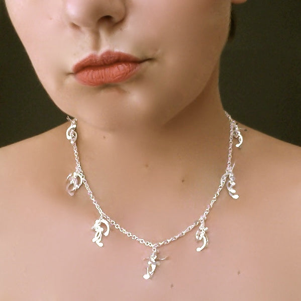 Contour charm Necklace, polished silver by Fiona DeMarco