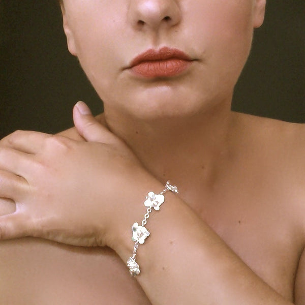 Symphony charm Bracelet, polished silver by Fiona Demarco
