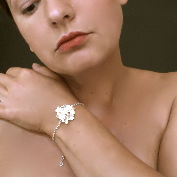 Symphony disc Bracelet, polished silver by Fiona DeMarco