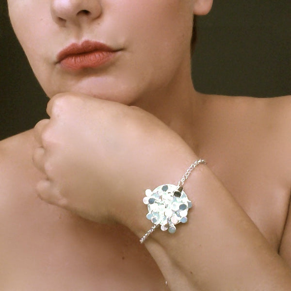Symphony disc Bracelet, polished silver by Fiona DeMarco