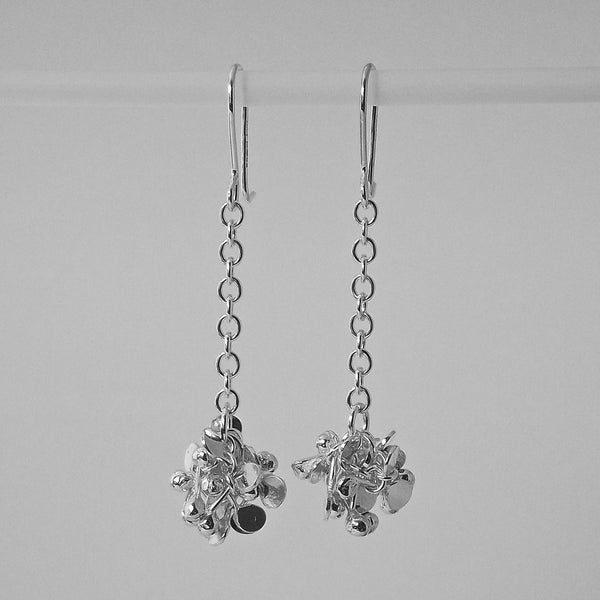 Radiance dangling Earrings, polished silver by Fiona DeMarco