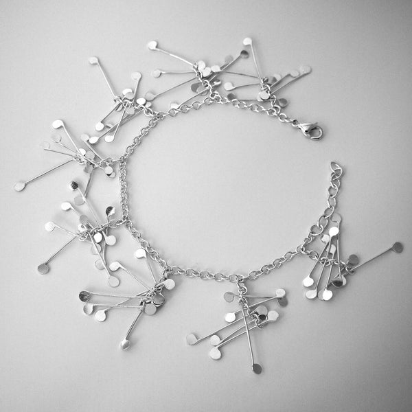 Signature charm Bracelet, polished silver by Fiona DeMarco