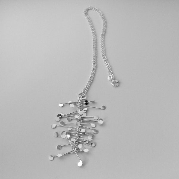 Signature Pendant, polished silver by Fiona DeMarco