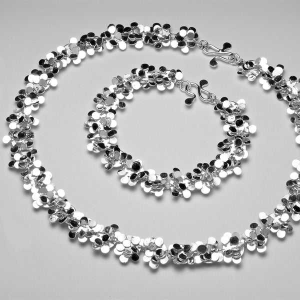 Symphony Bracelet and Necklace, polished silver by Fiona DeMarco