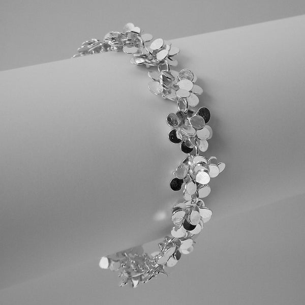 Symphony Bracelet, polished silver by Fiona DeMarco