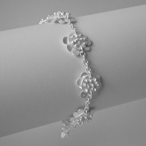 Symphony charm Bracelet reverse side, satin silver by Fiona DeMarco