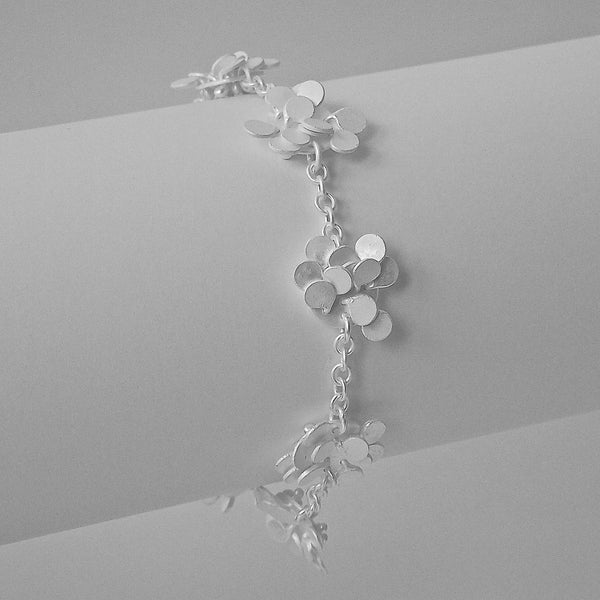 Symphony charm Bracelet, satin silver by Fiona DeMarco